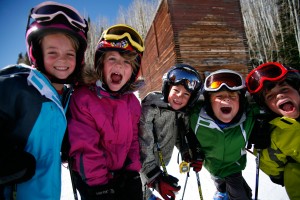 Kids doing winter sports yelling with regular protection and UV protection on